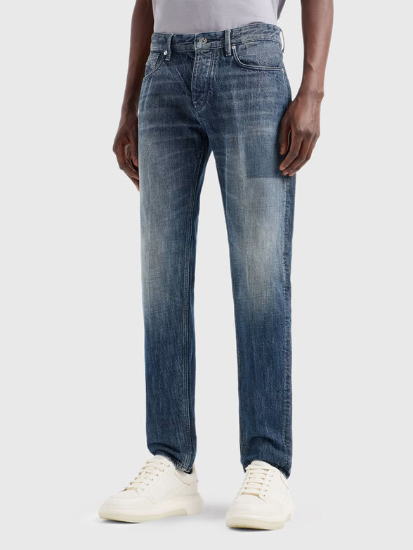 Blue jeans with washed effect and logo - 0