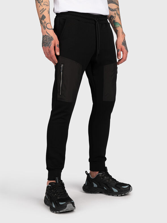 Sports trousers with accent zips and logo - 1
