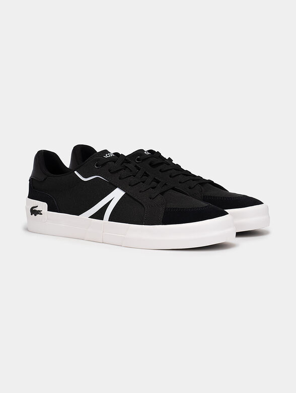 Black sneakers with laces and white accents - 2