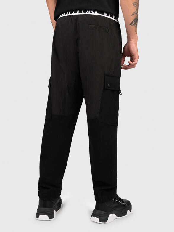 Black track pants with logo detail - 1