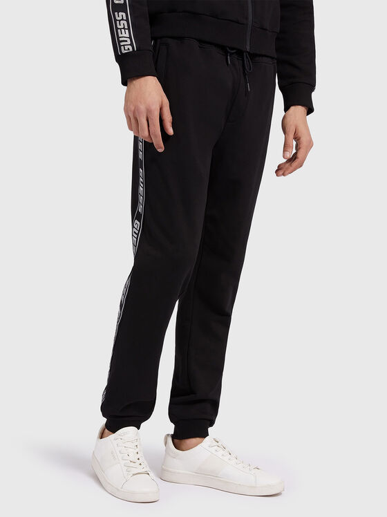 Black sports pants with logo edging - 1
