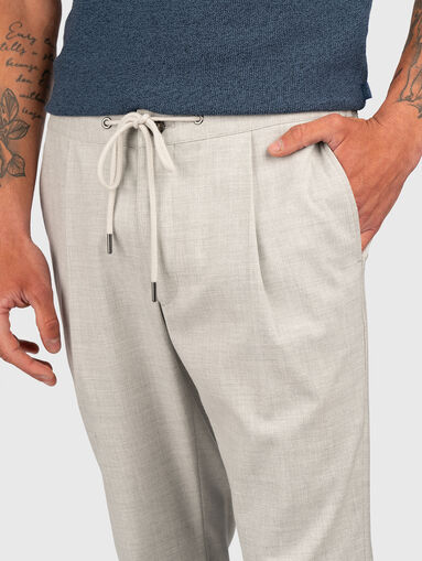 Trousers with waist  ties and pockets - 4