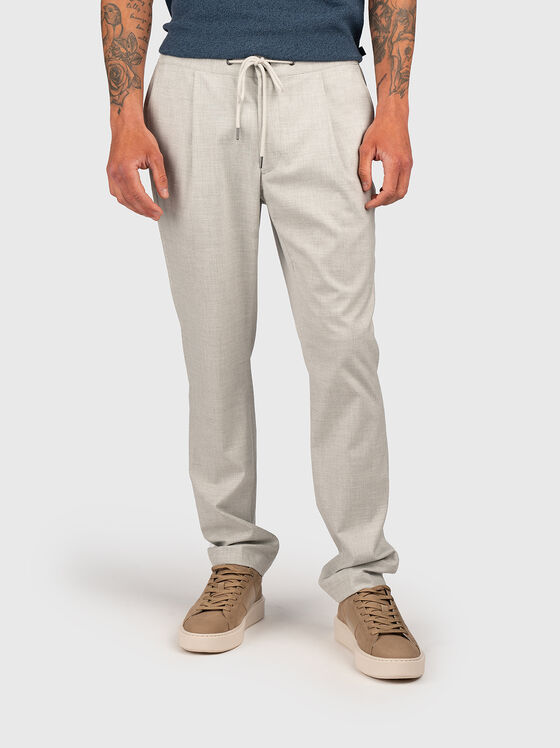 Trousers with waist  ties and pockets - 1