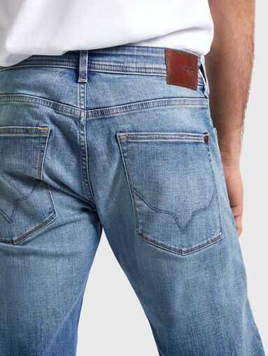 Light blue jeans with accent rips  - 2