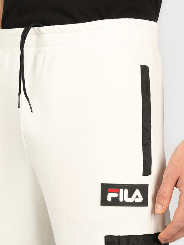 Sports pants with contrasting pocket - 1