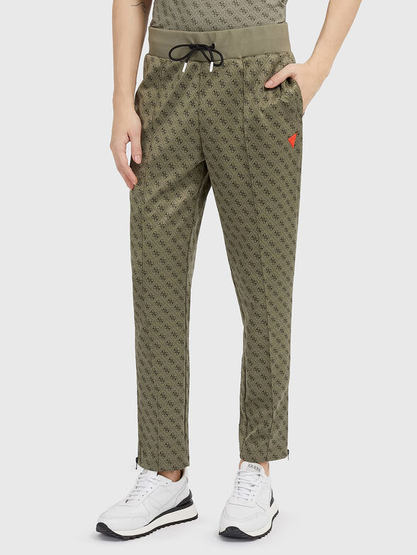 Monogram logo print sweatpants in beige - 1