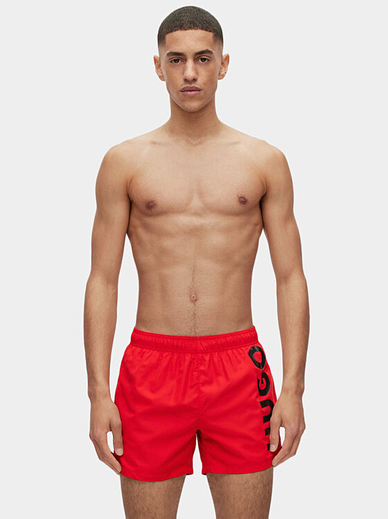 Black beach shorts with logo detail - 1