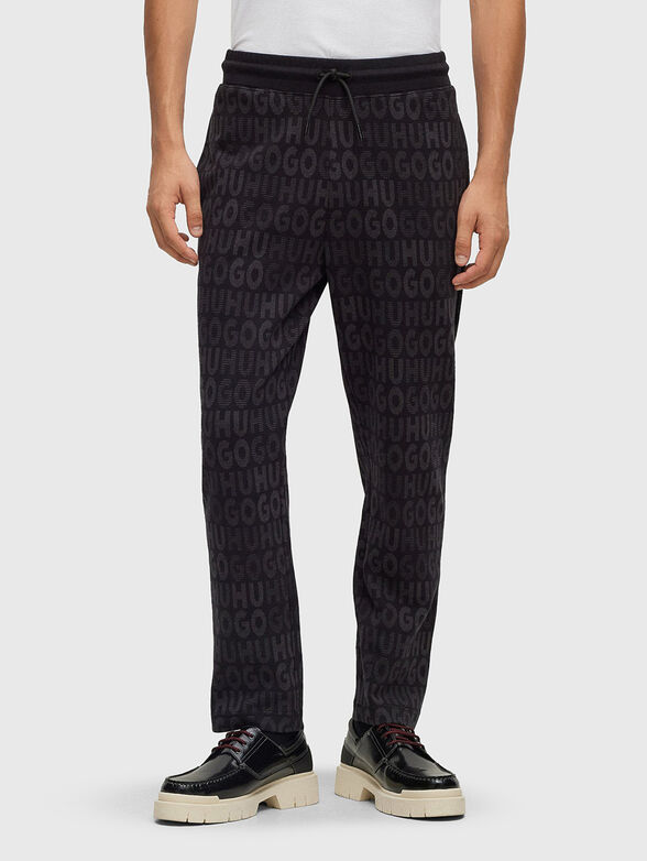 Sports trousers with monogram logo print - 1
