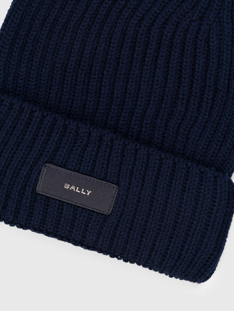Knitted hat in dark blue color - 3