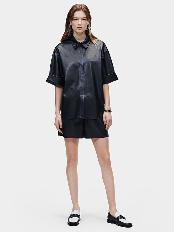 Black faux leather shirt with perforated logos - 1