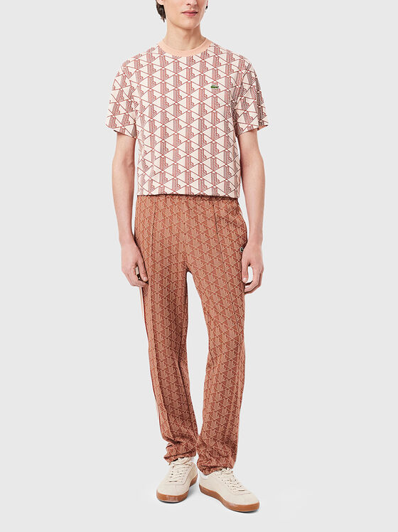 Sports trousers with monogram print - 1