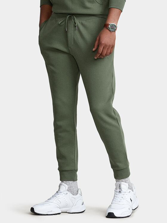 Sports pants with embossed logo - 1