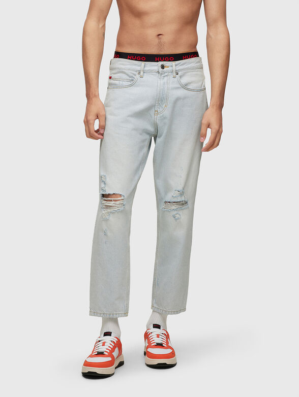 Light blue jeans with distressed effect - 1