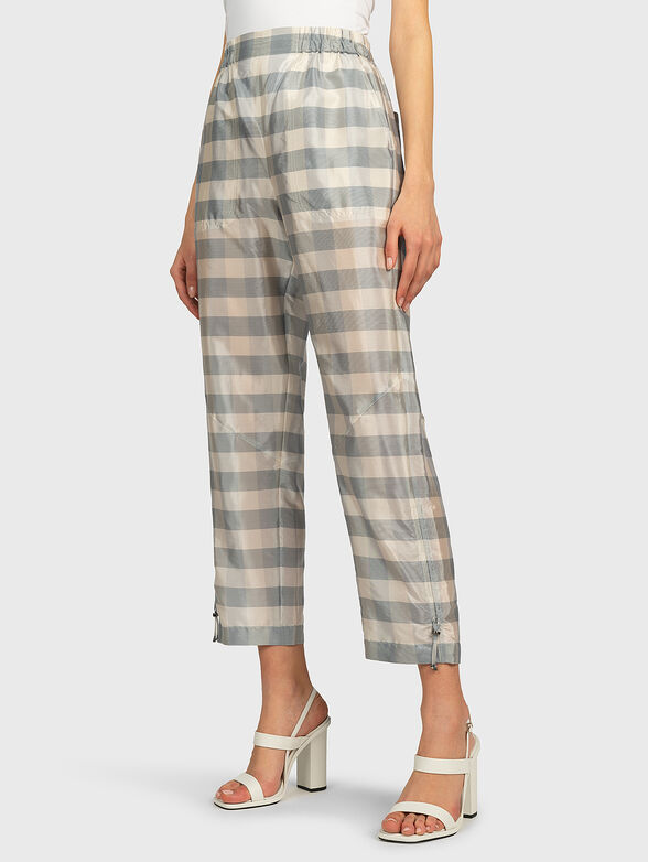 Pants with a checkered print - 0