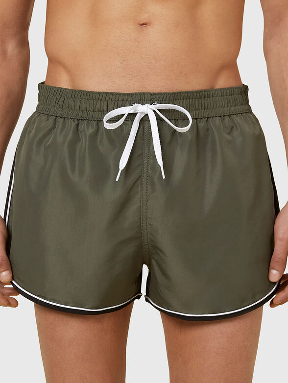 PASSEPARTOUT beach shorts in black - 1