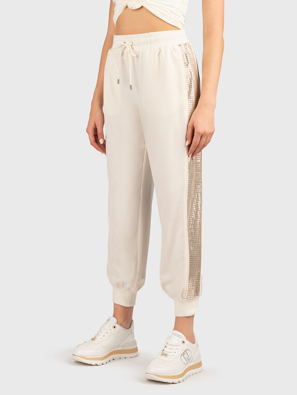 Sports trousers with sequins and logo - 1