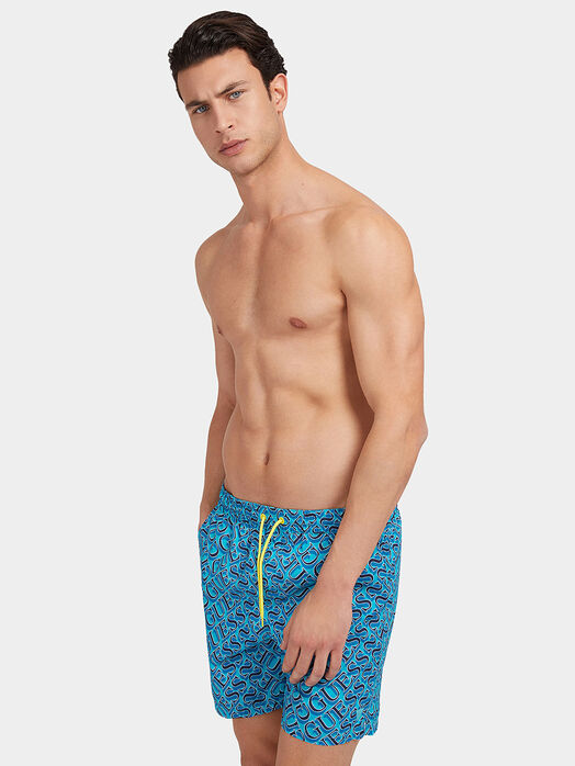 Blue swim trunks with logo print