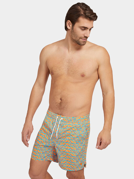 Blue swim trunks with logo print - 1