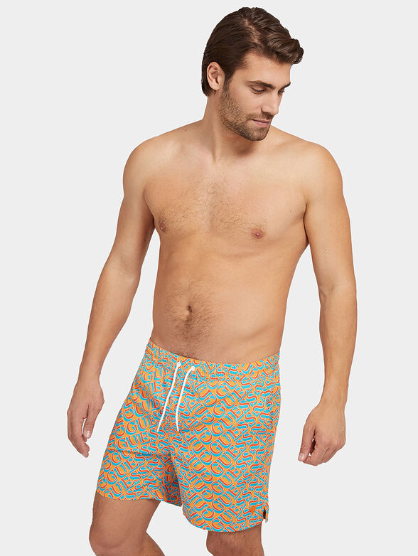 Blue swim trunks with logo print - 1