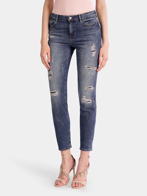 Cropped jeans with ripped details - 1