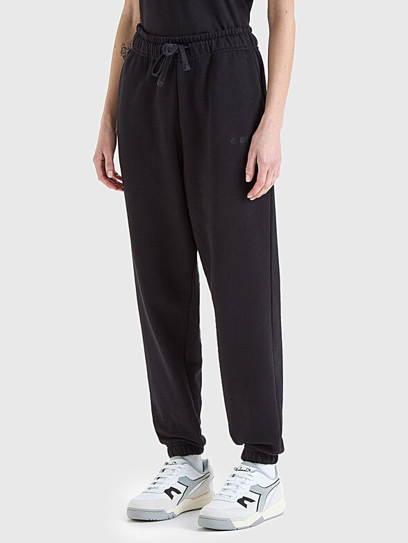 Sports pants in black with logo element - 1